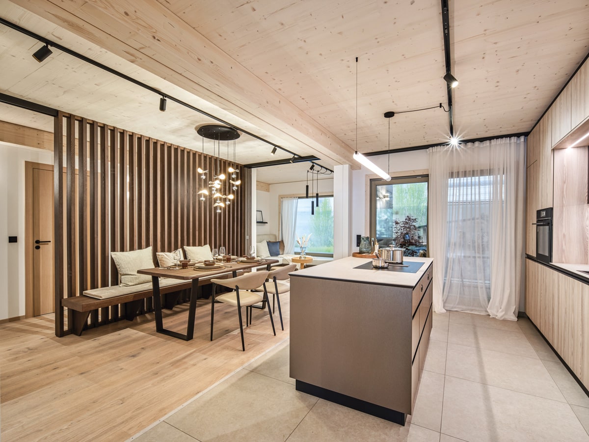 /files/dateien/H%C3%A4user/Elements/Three/modulhaus-holz-bungalow-offenes-wohnen.jpg