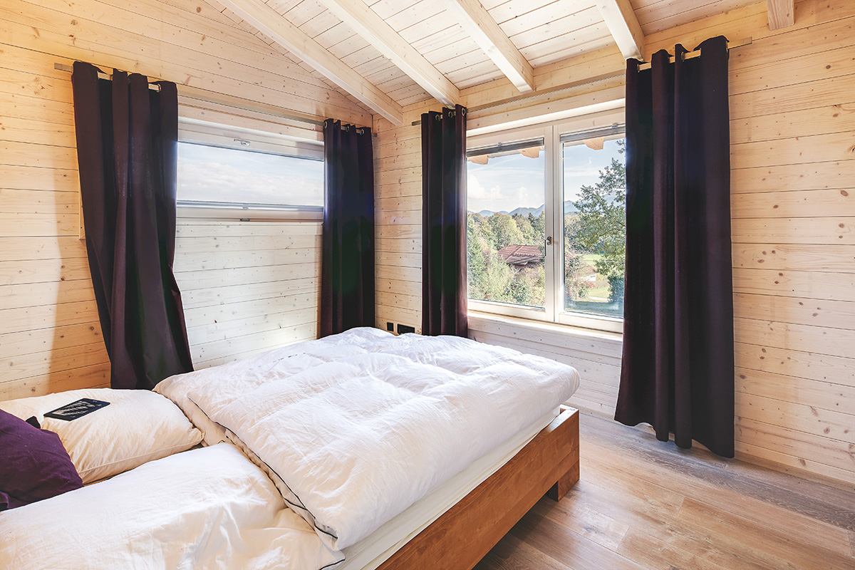 /files/dateien/H%C3%A4user/Kundenh%C3%A4user/Gusto/modernes-holzhaus-gusto-minimalistisches-schlafzimmer.jpg